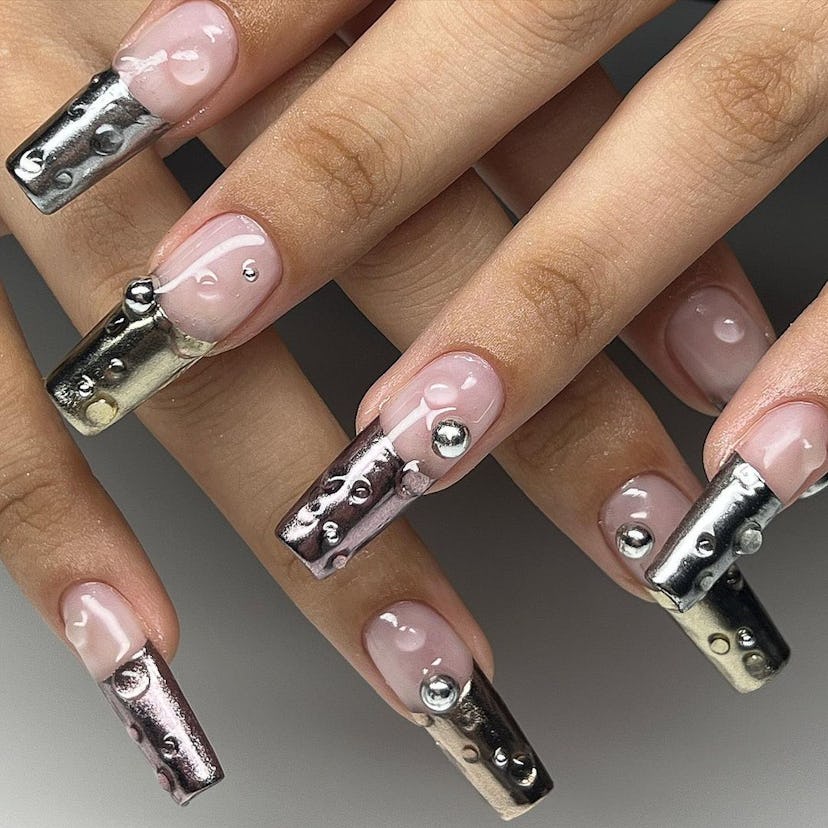 Try silver chrome French tip nails with 3D dew drops.