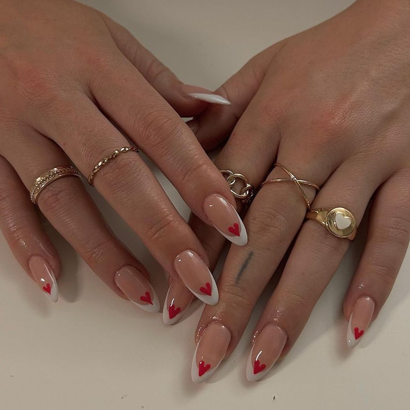 Try French tip nails with tiny red hearts.