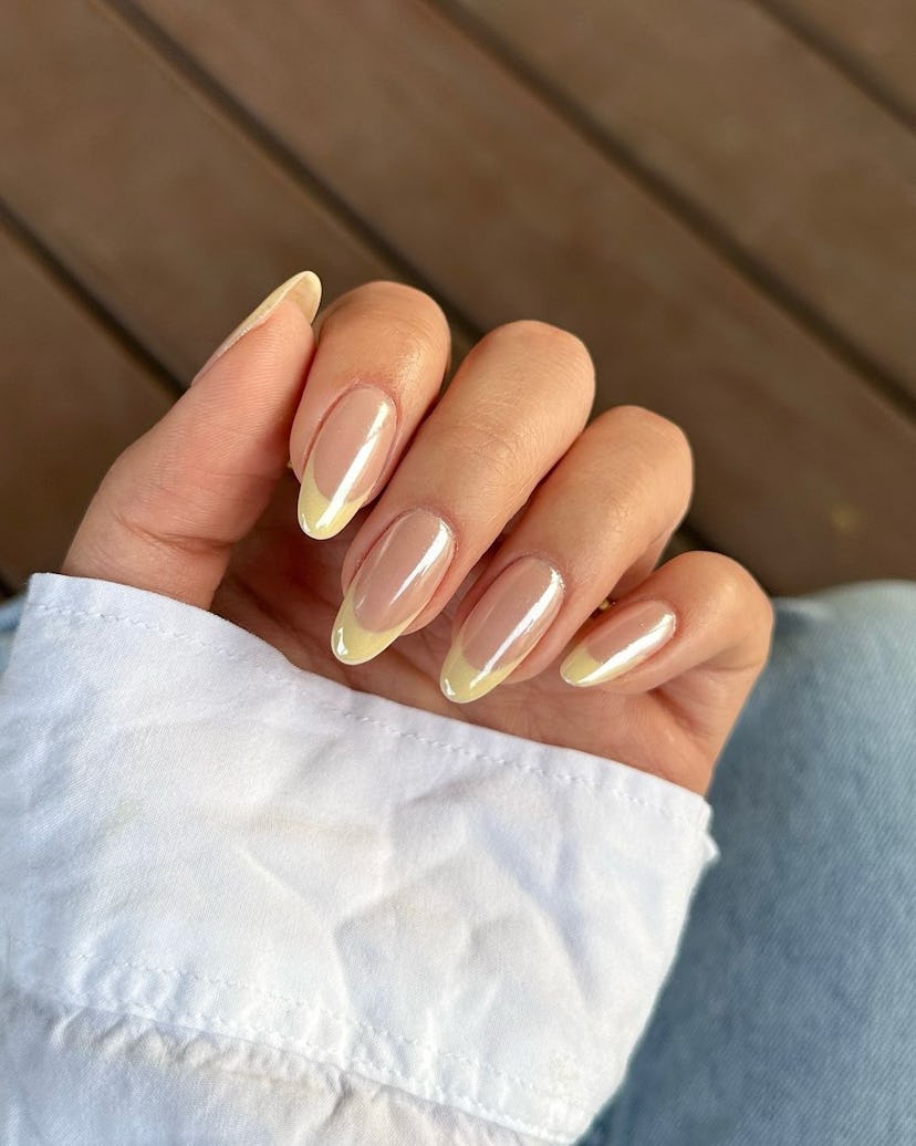 Try butter yellow chrome French tip nails.