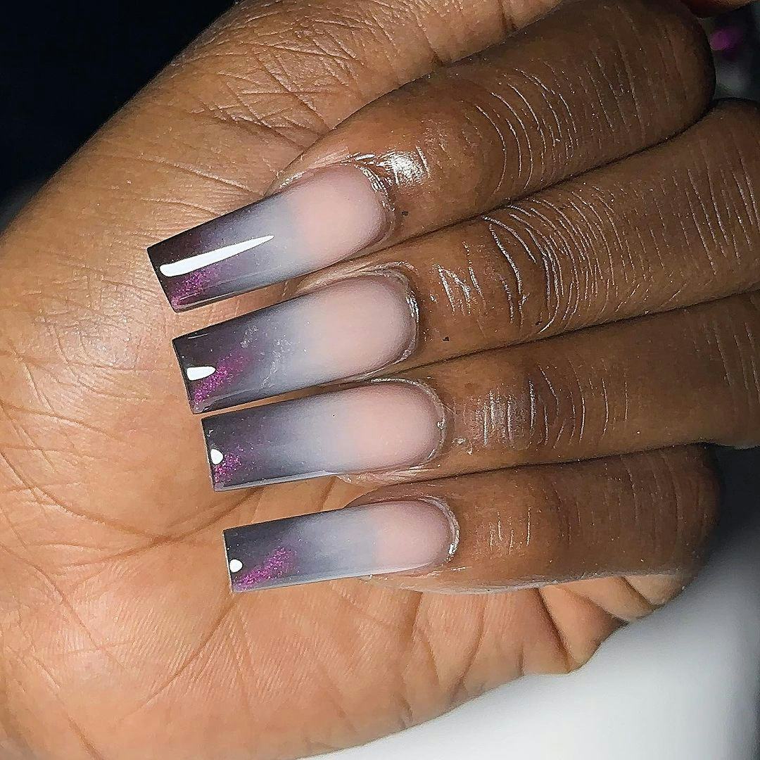 Try faded gray galaxy French tip nails.