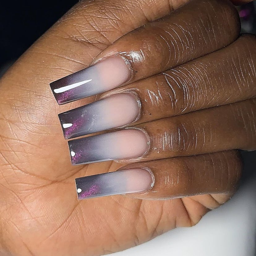 Try faded gray galaxy French tip nails.