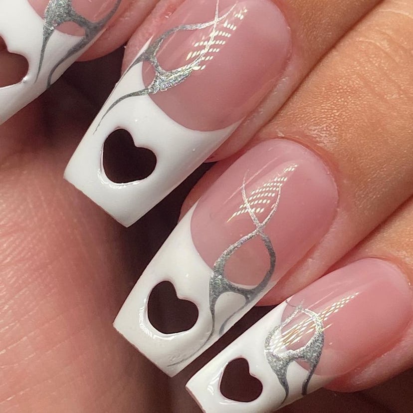 Try French tip nails with heart-shaped cutouts.