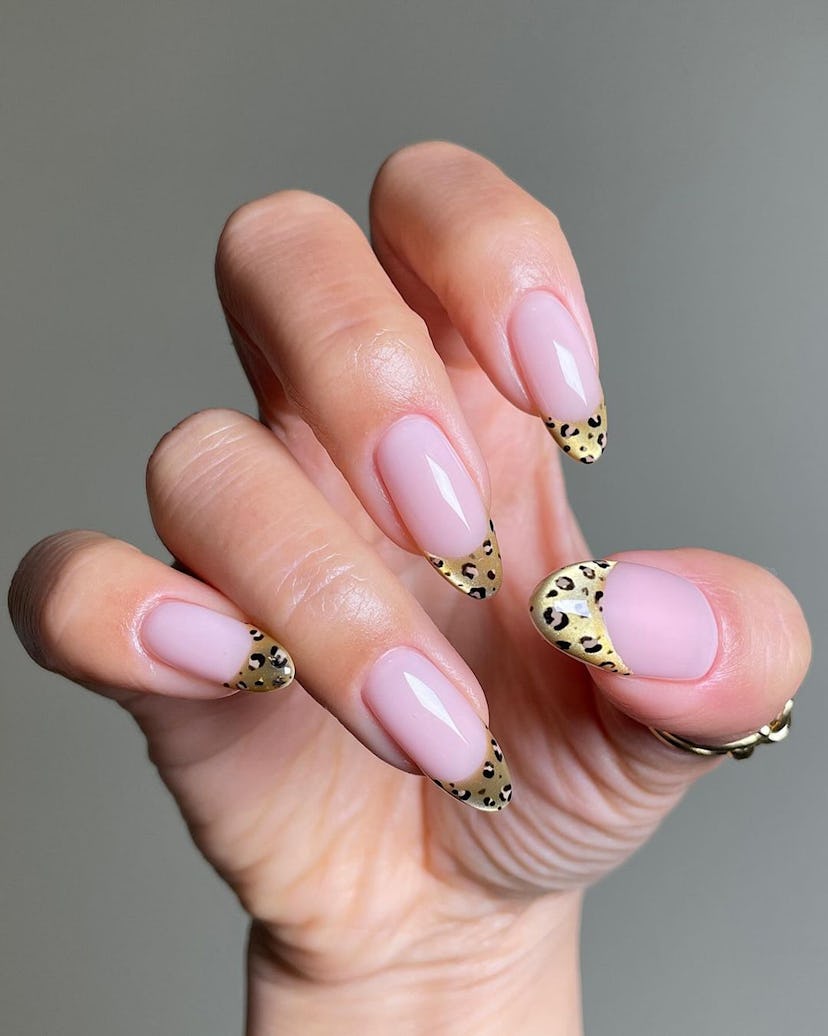 Try golden leopard print French tip nails.