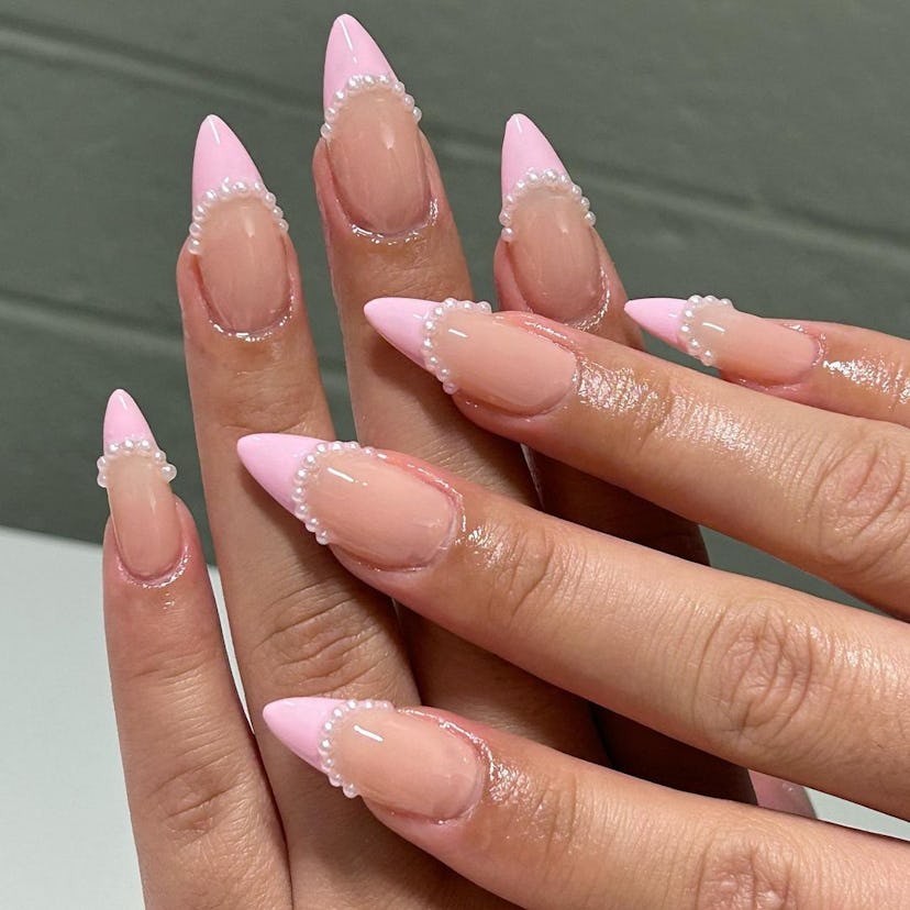 Try pearl-lined pastel pink French tip nails.