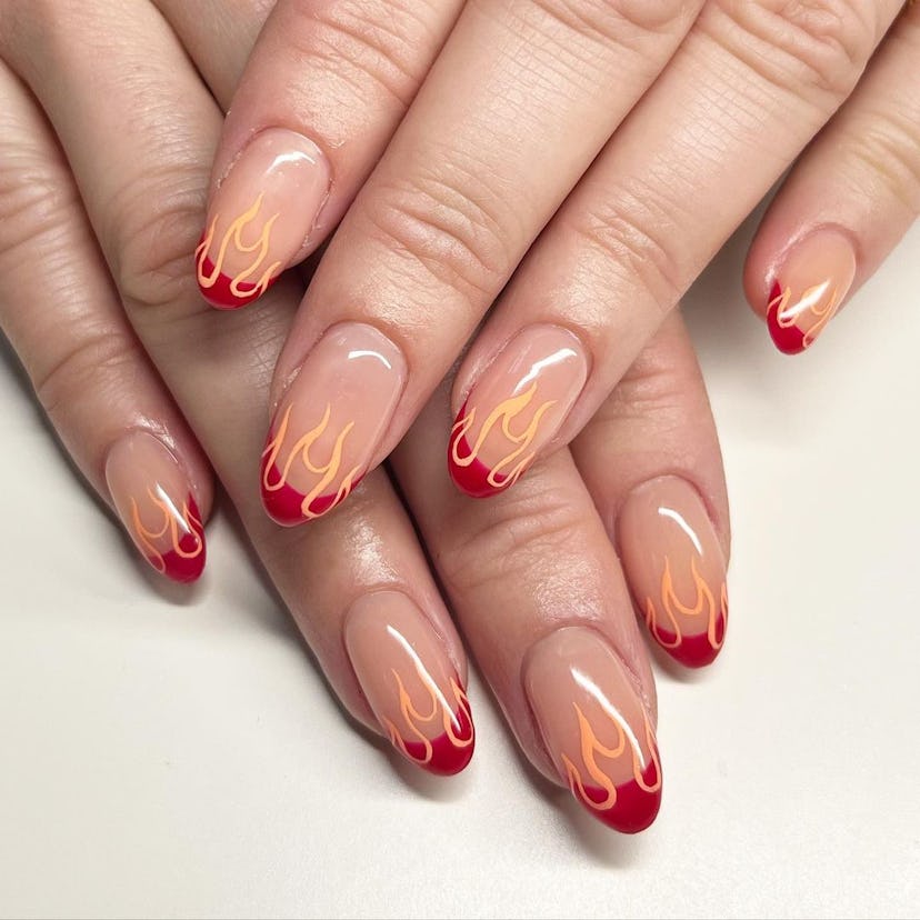 Try red French tip nails with flame details.