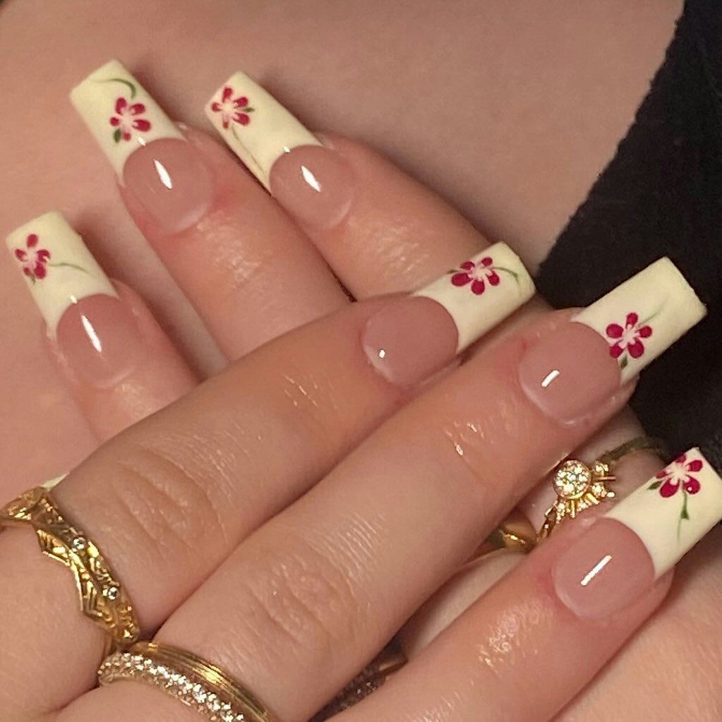 Try French tip nails with hibiscus flower art.