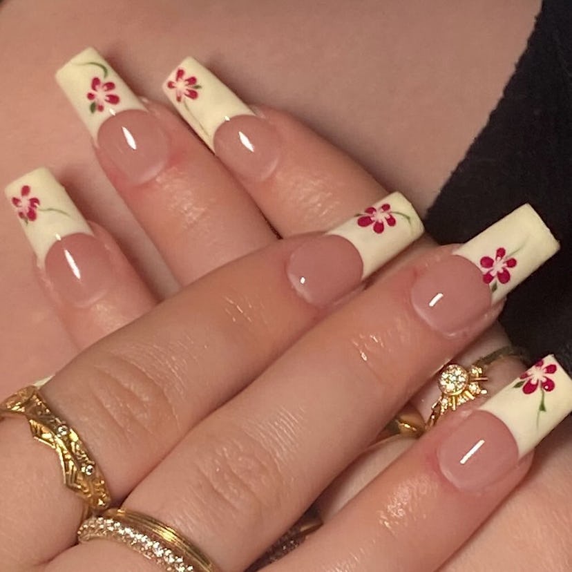 Try French tip nails with hibiscus flower art.