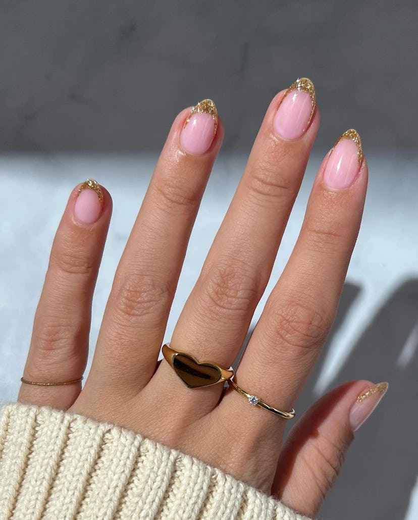 Try glittering gold French tip nails.