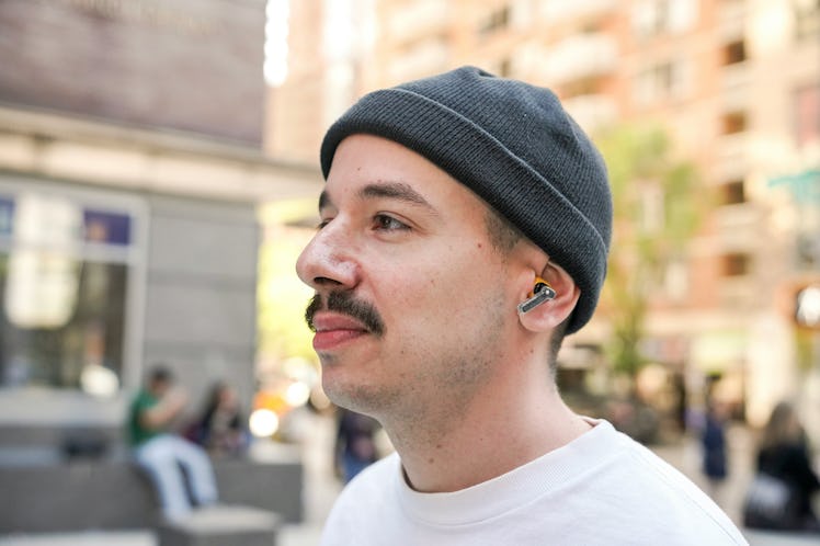 Inverse Senior Editor James Pero wearing Nothing Ear A wireless earbuds.