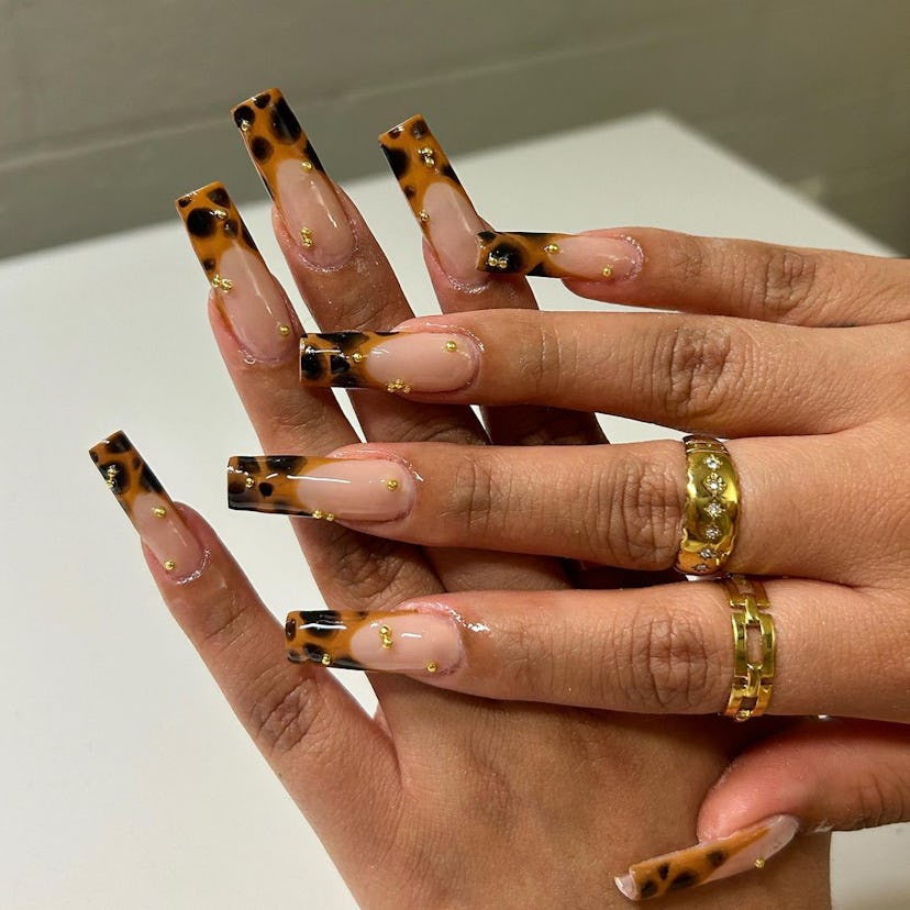 Try warm-toned tortoiseshell French tip nails.