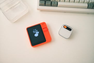 The Rabbit R1 compared to the Humane AI Pin.