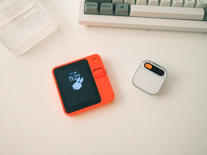 The Rabbit R1 compared to the Humane AI Pin.