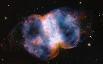 A Hubble image of the Little Dumbbell Nebula. The name comes from its shape, which is a two-lobed st...