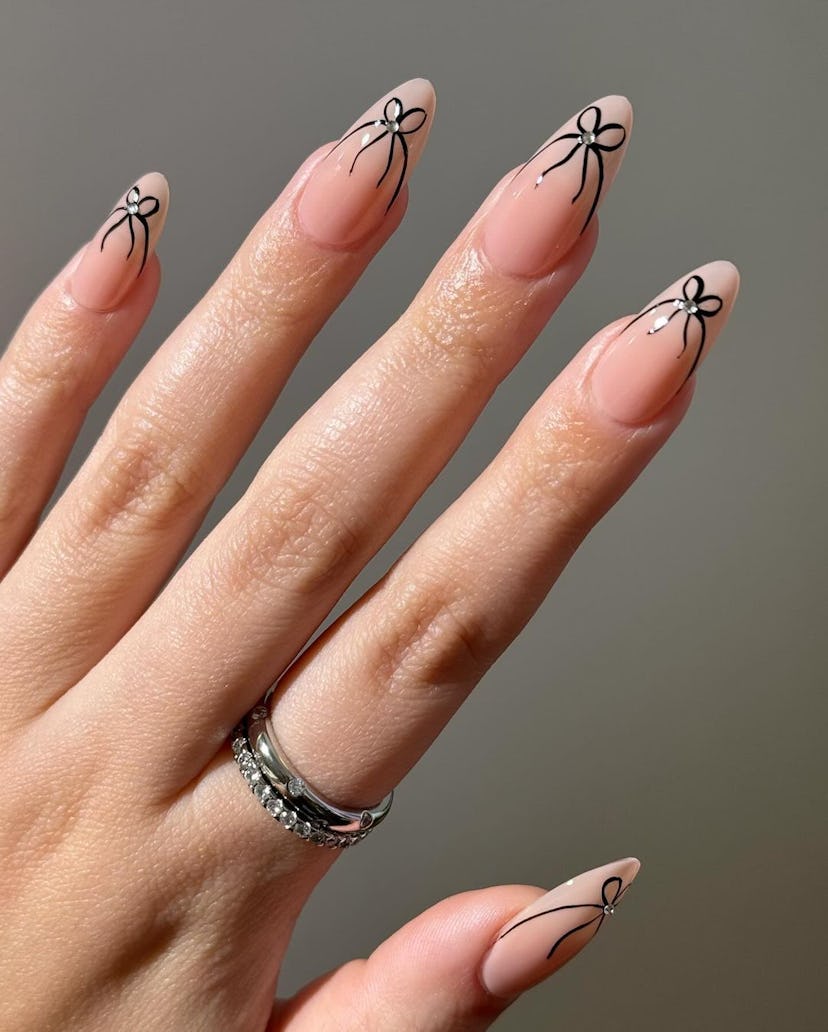 Try thin black ribbon French tip nails.
