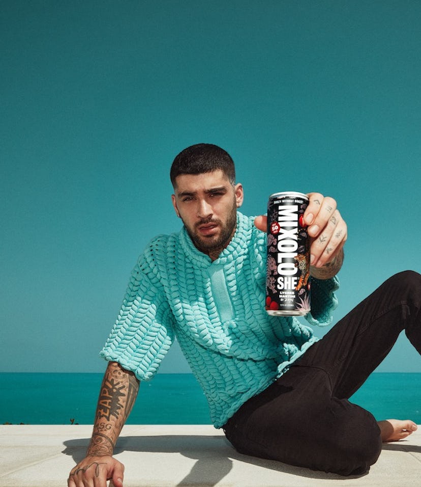 Zayn Malik holding his Mixoloshe Lychee Martini.
