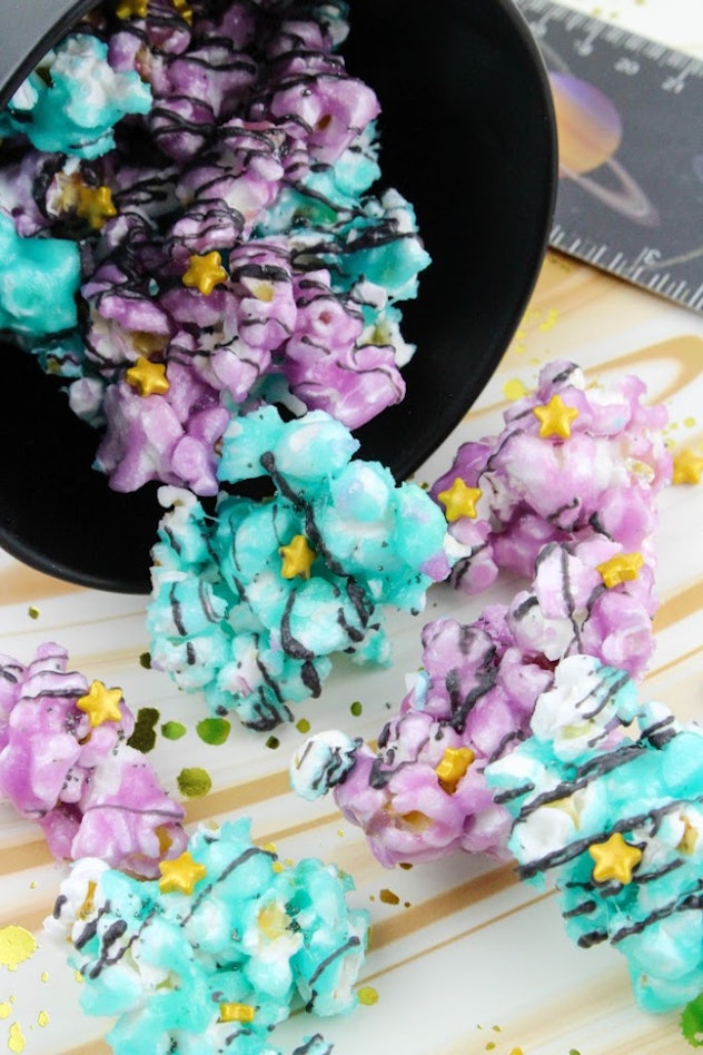 Blue and purple galaxy themed popcorn, a cute and easy eclipse party snack idea