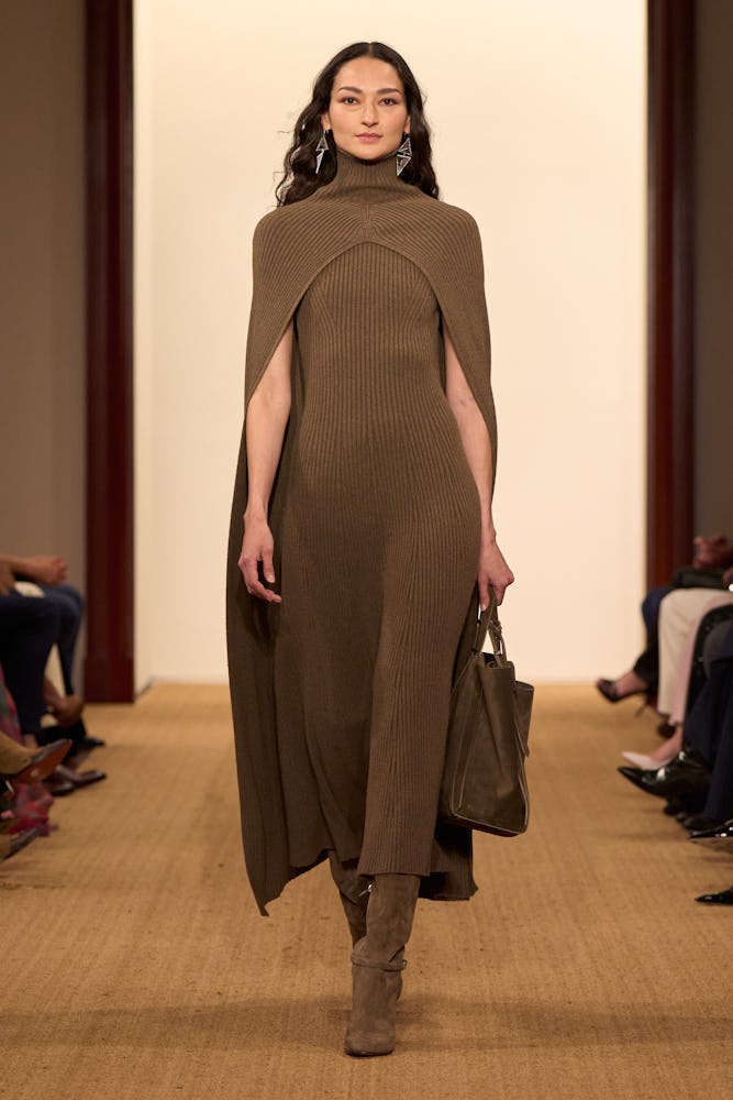 Bruna Tenorio in brown knit cape and dress