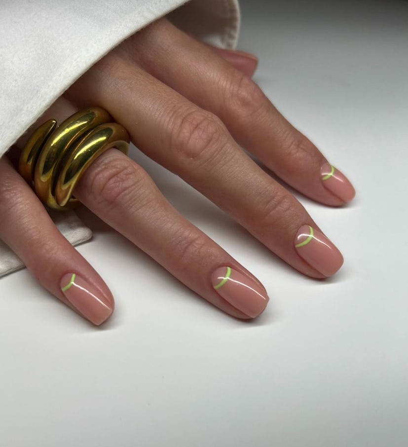 Try neutral nails with lime green half moon outlines.