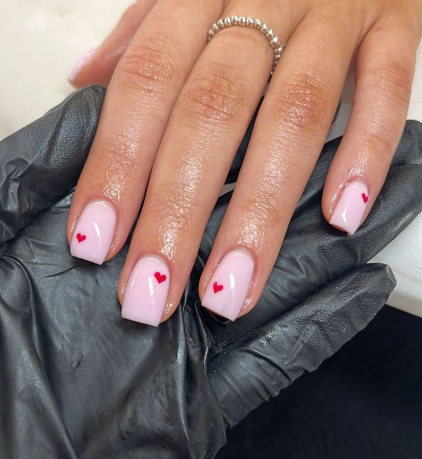 Try pink nails with red heart designs.