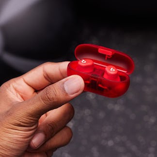 Beats $79.99 Solo Buds wireless earbuds in red with transparent red charging case