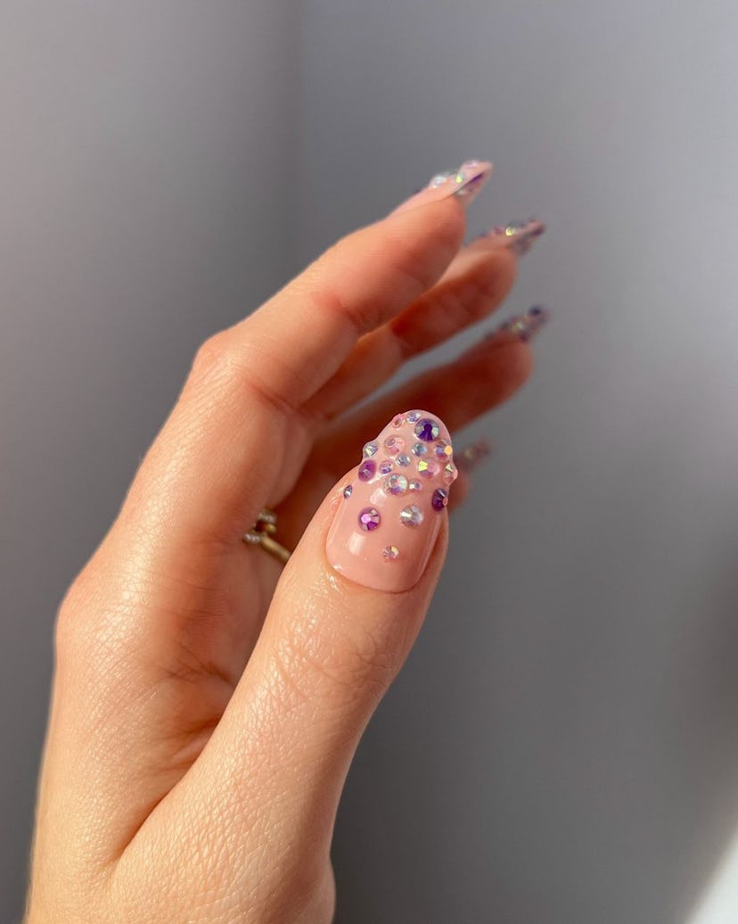 Rhinestone studded nails are trending for summer 2024.