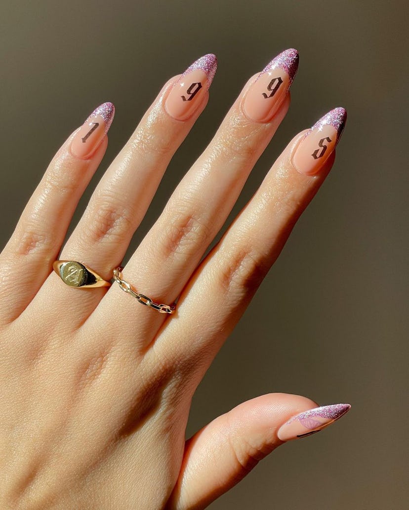 Nail stickers and nail tattoos are trending for summer 2024.