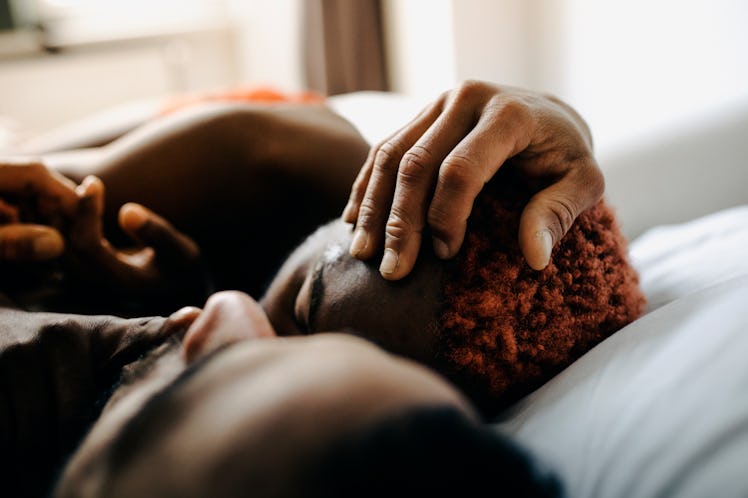 Young couple in bed as two zodiac signs to date if you want a passionate sex life.