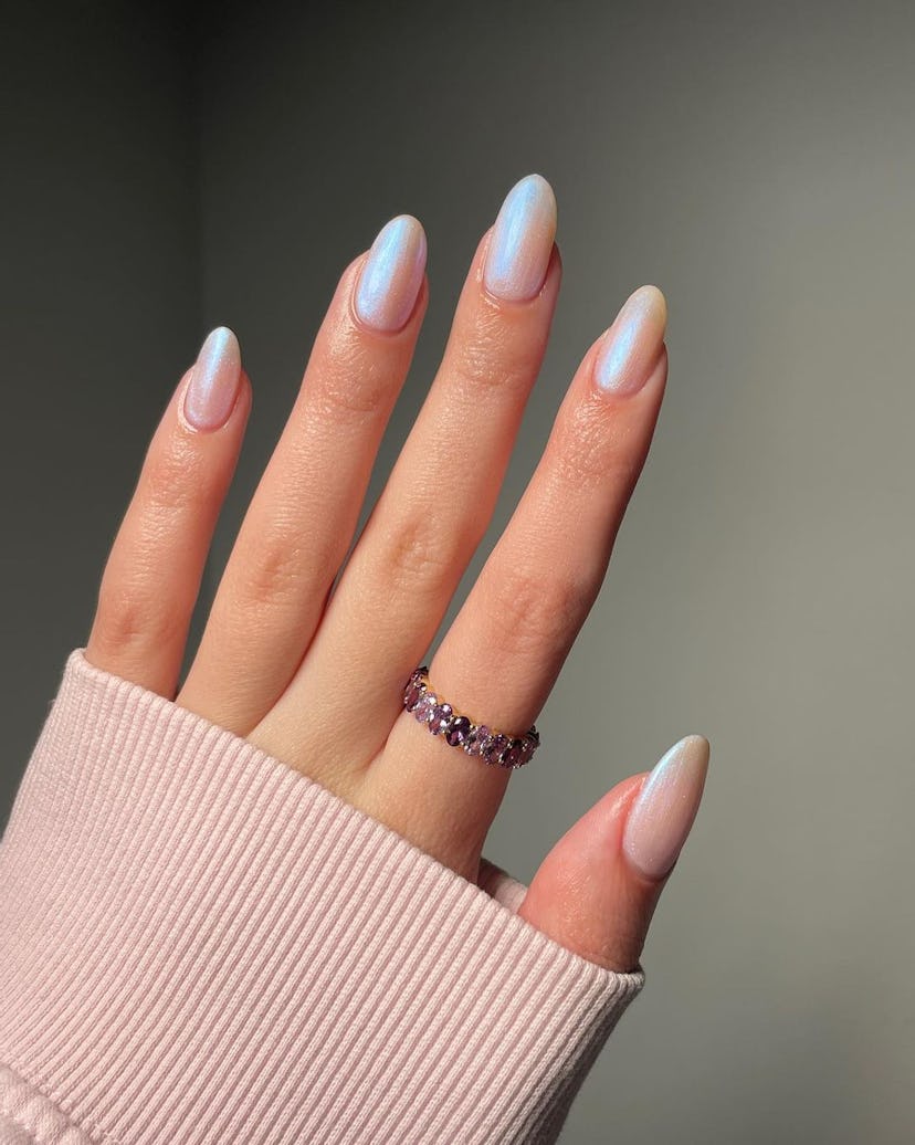 Pearly nail polish is on-trend for summer 2024.