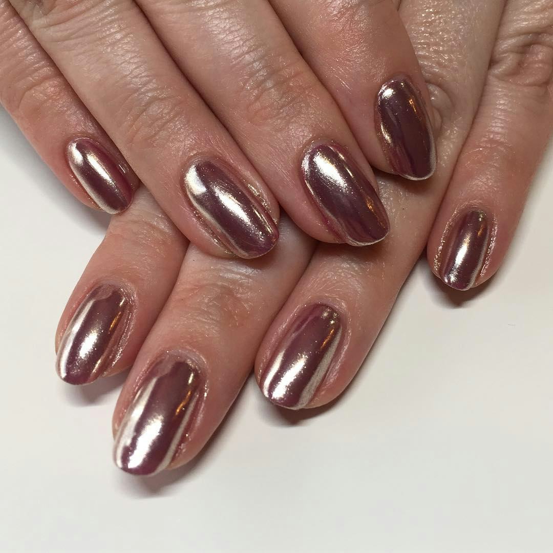 Rose gold nail polish is on-trend for summer 2024.