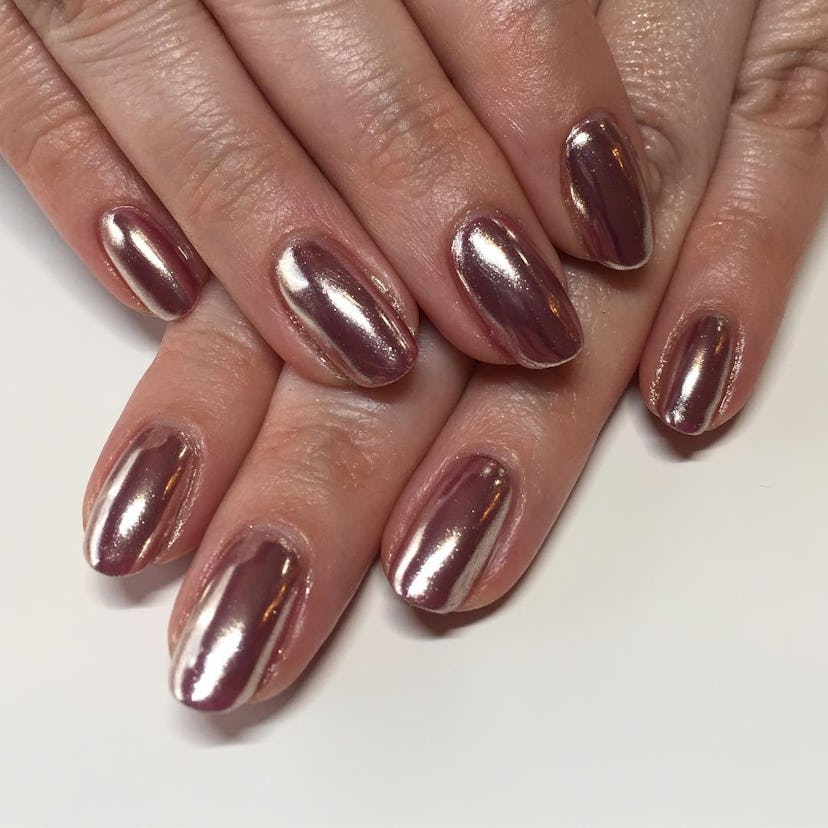 Rose gold nail polish is on-trend for summer 2024.