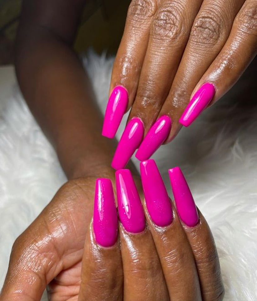 Magenta nail polish is on-trend for summer 2024.