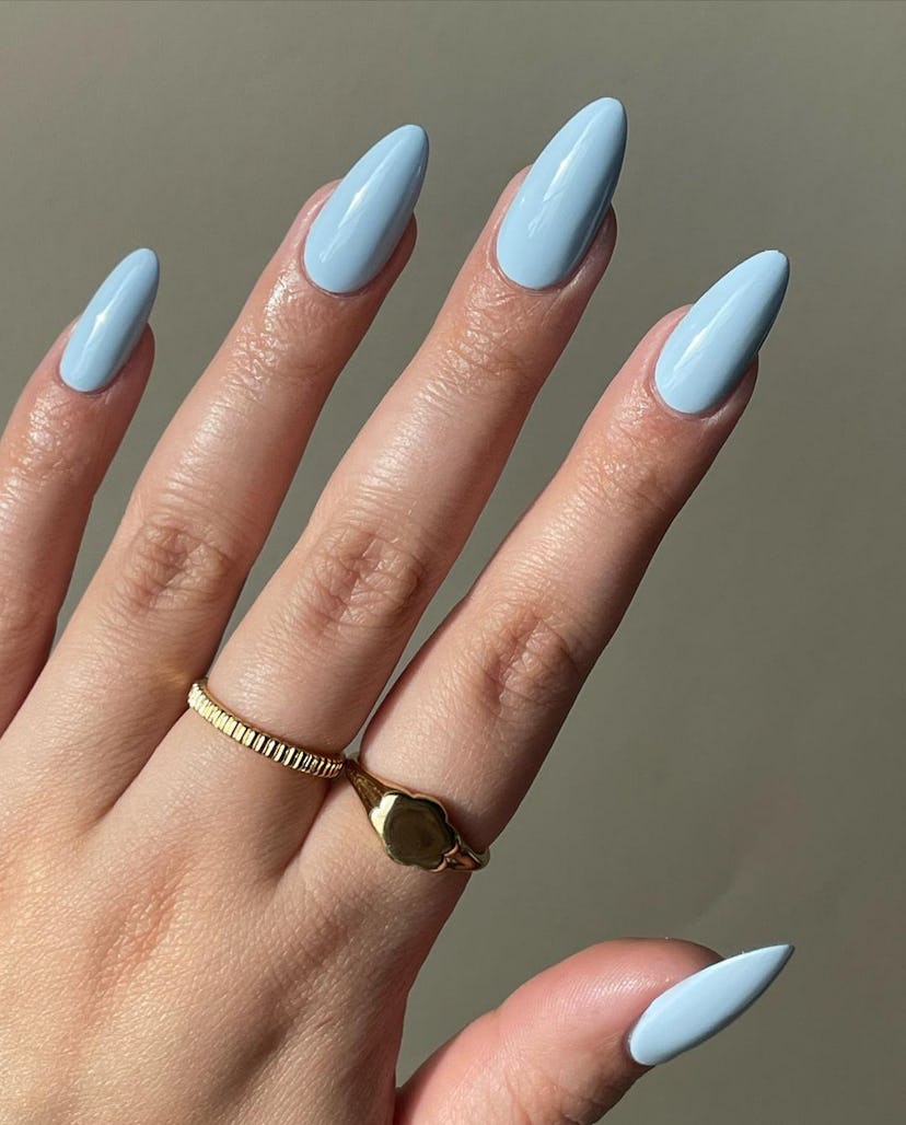 Baby blue nail polish is on-trend for summer 2024.