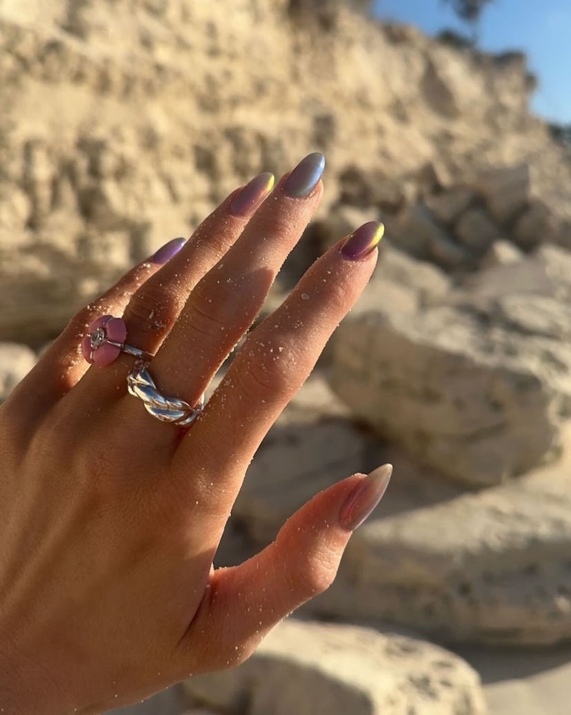 Kylie Jenner’s purple-grey and gold chrome nails are on-trend.