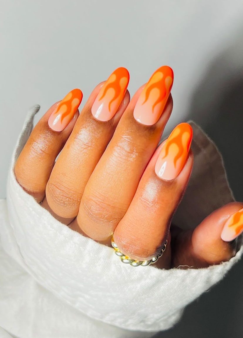 Try vibrant orange flame designs on your nails.