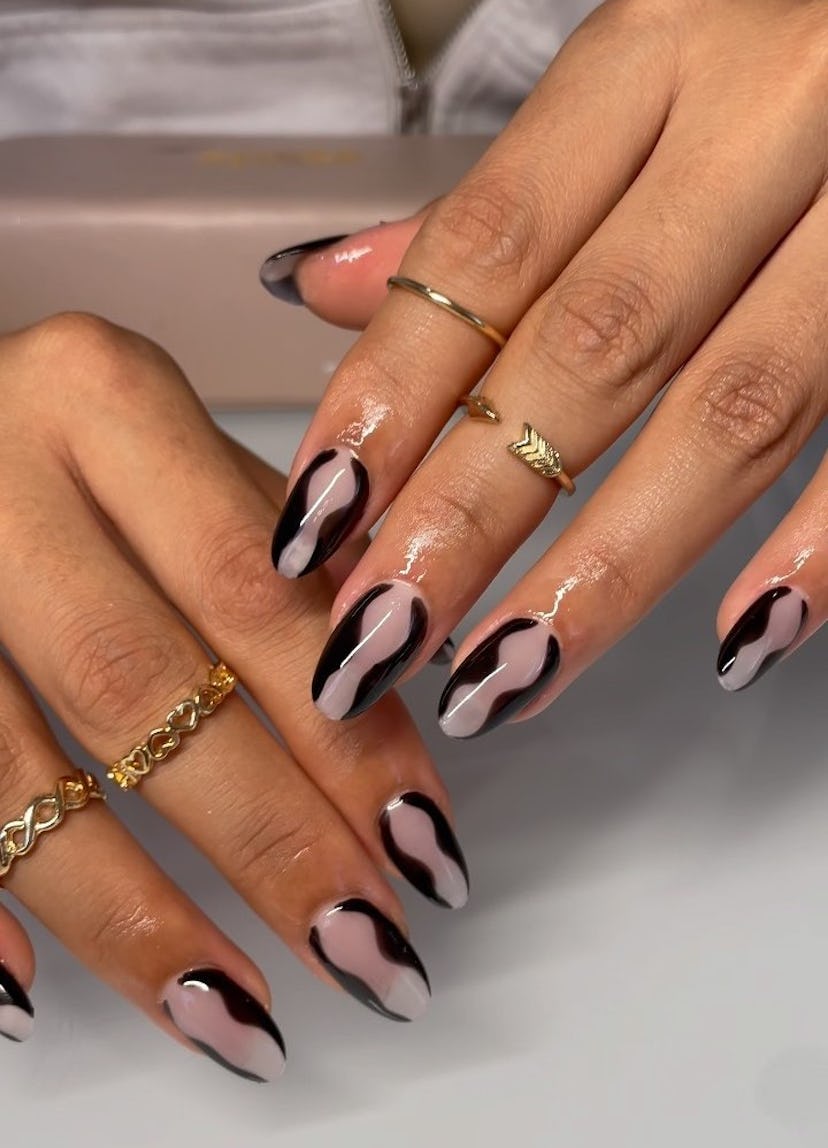 Try black hourglass nail art.