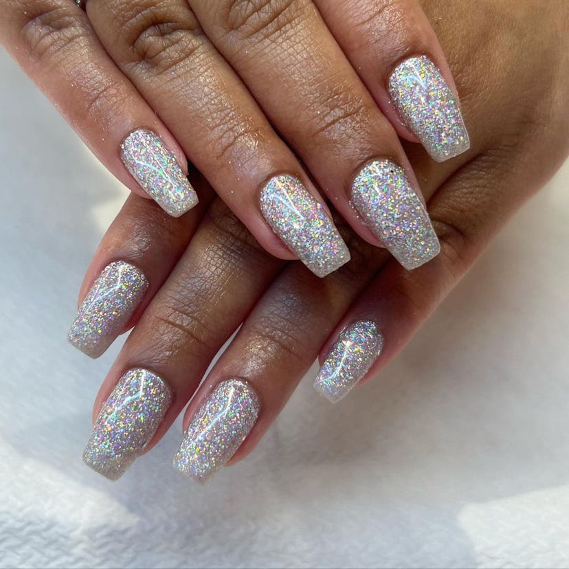 Try holographic silver glitter nails.