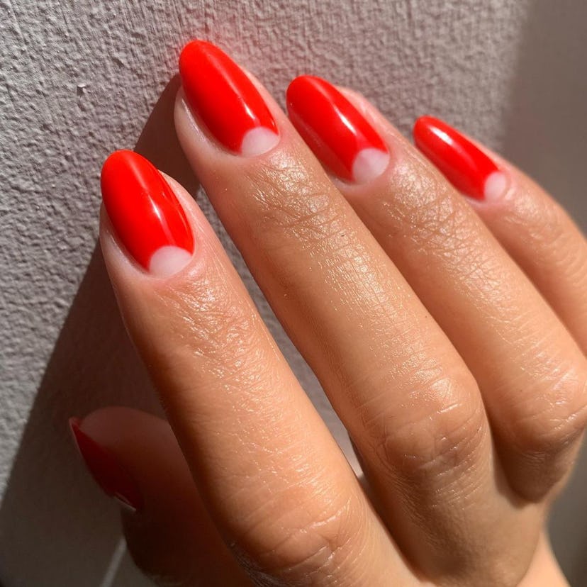 Try a retro red half moon manicure.