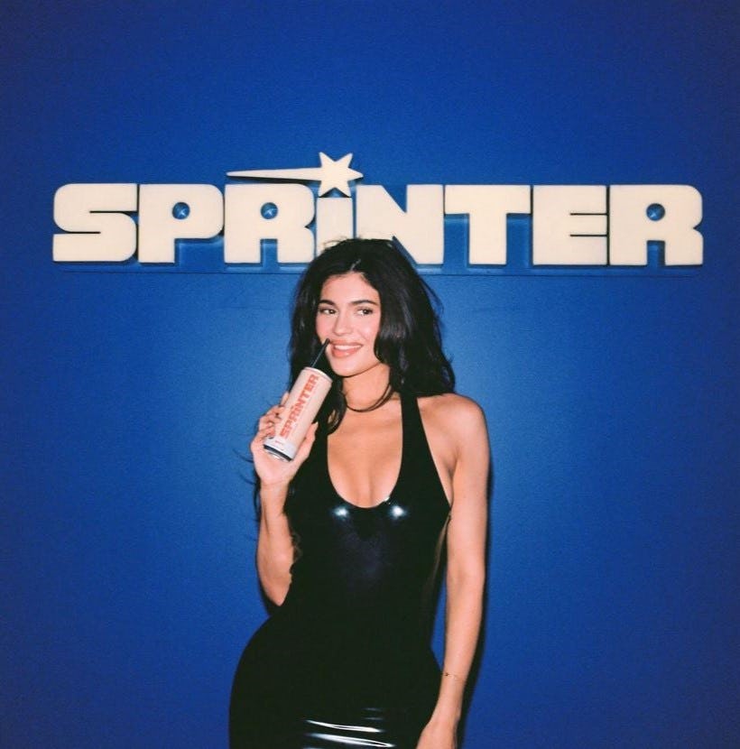 Kylie Jenner wore a black latex bodysuit and skirt to her Sprinter launch.