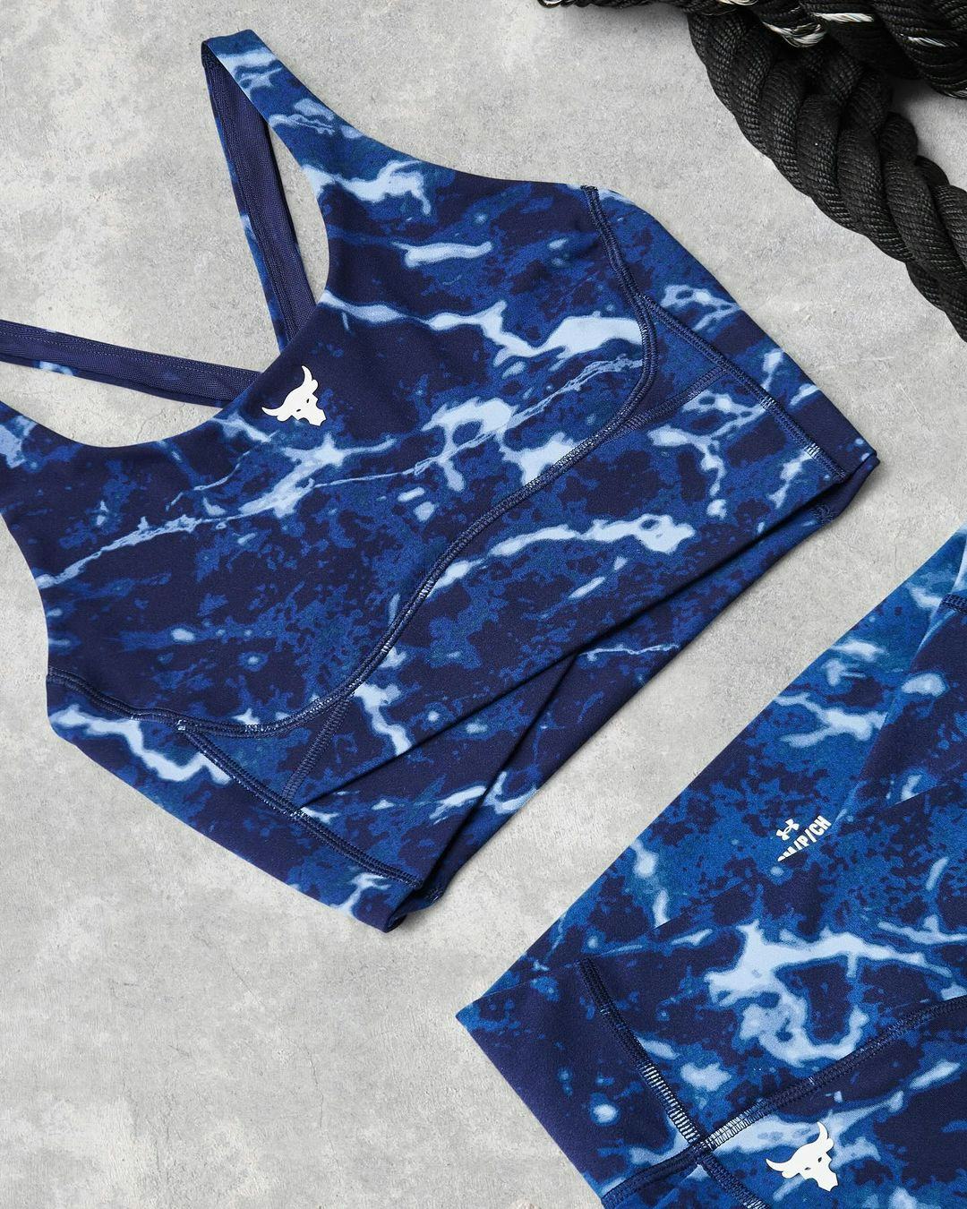 Workout clothes laid on the floor.