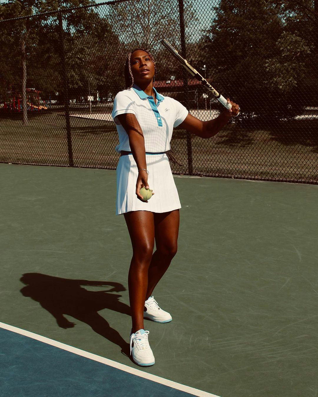 A woman playing tennis.
