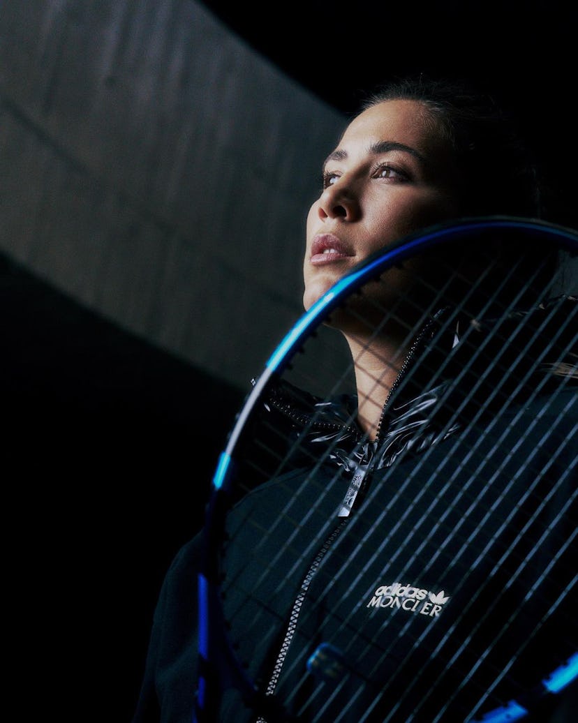 A woman with a tennis racket.