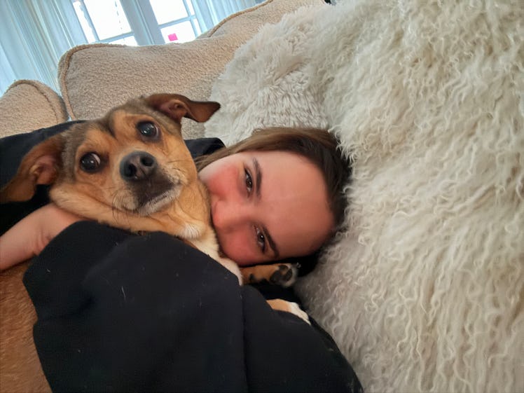 Bailee Madison cuddles with her dog in the morning. 