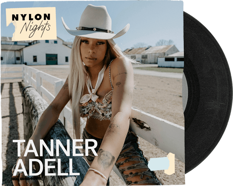 Promotional image of Tanner Adell in a cowboy hat, sitting on a fence at a ranch, for Nylon Nights e...