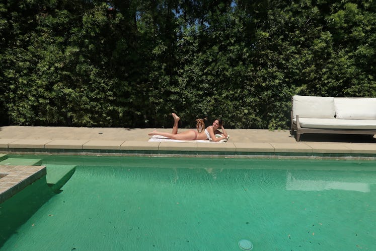 Bailee Madison lounges by the pool before the 'Pretty Little Liars' premiere. 
