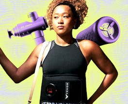 A woman holds a massage gun, wearing a waist belt for therapy and carrying a yoga mat, depicting exe...