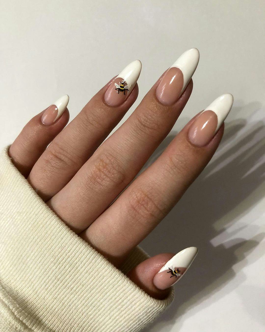 These French tip nails with bumblebee art are inspired by &lsquo;Bridgerton.'