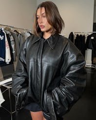 hailey bieber wears a black leather bomber jacket
