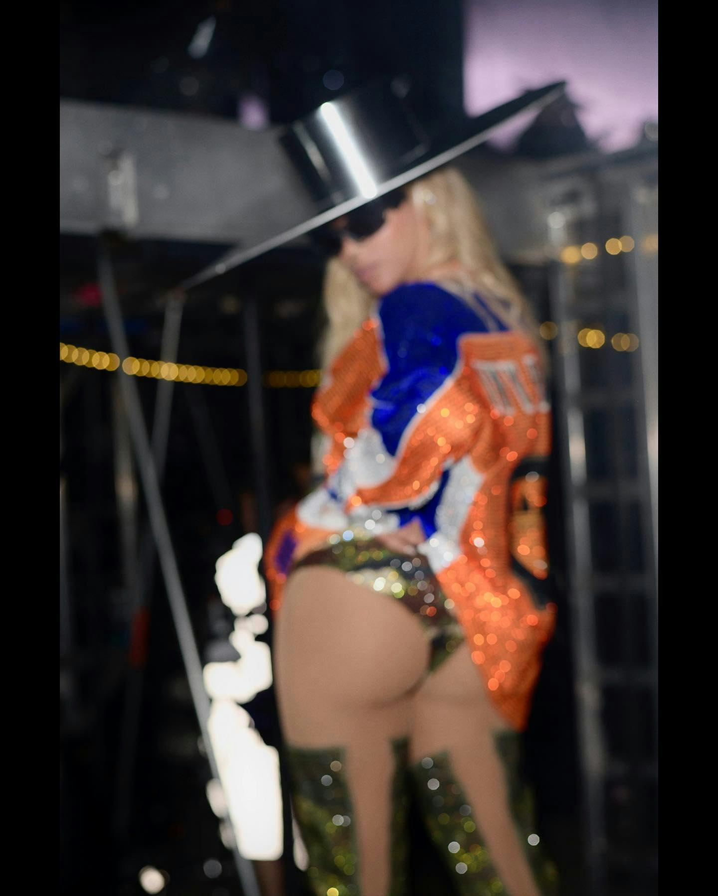 Beyoncé wears a sequined jersey and camouflage thong backstage at the Renaissance Tour.