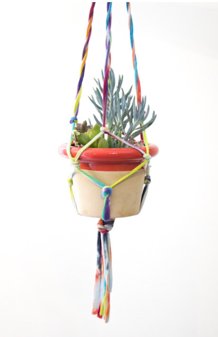 One summer tie-dye craft to make is a tie-dye macrame plant holder.
