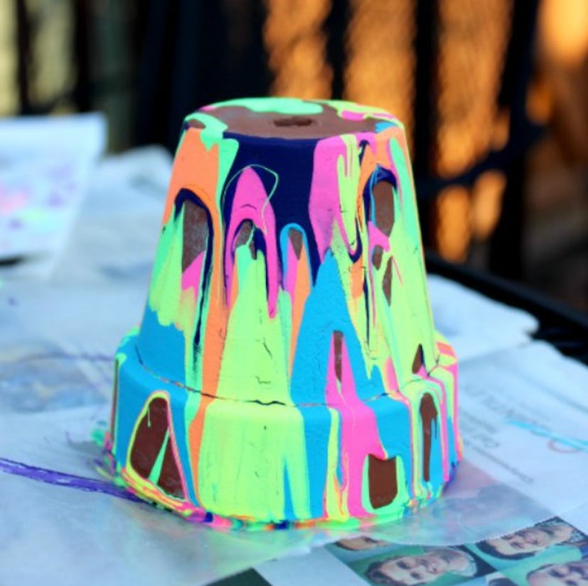 One summer tie-dye craft to make is this squeeze paint clay pot.